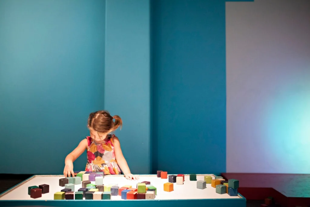 Little girl playing with museum display