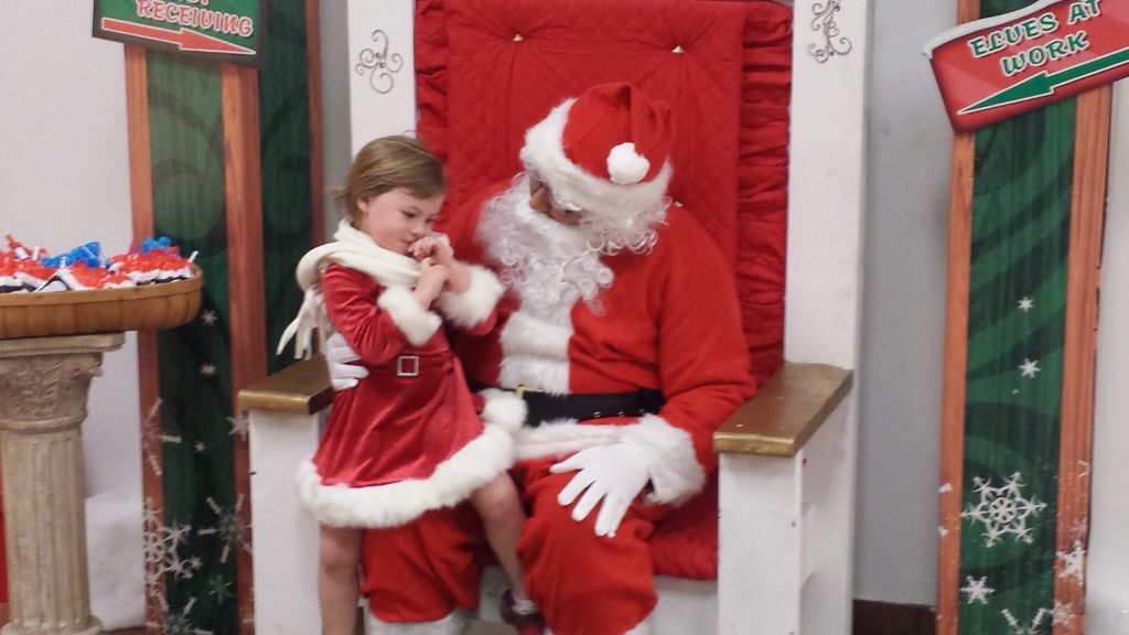 Little girl meeting Santa at Santa Claus House