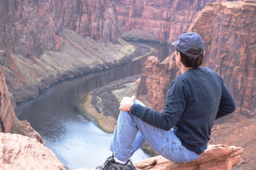 Man looking at scenic view of Colorado River