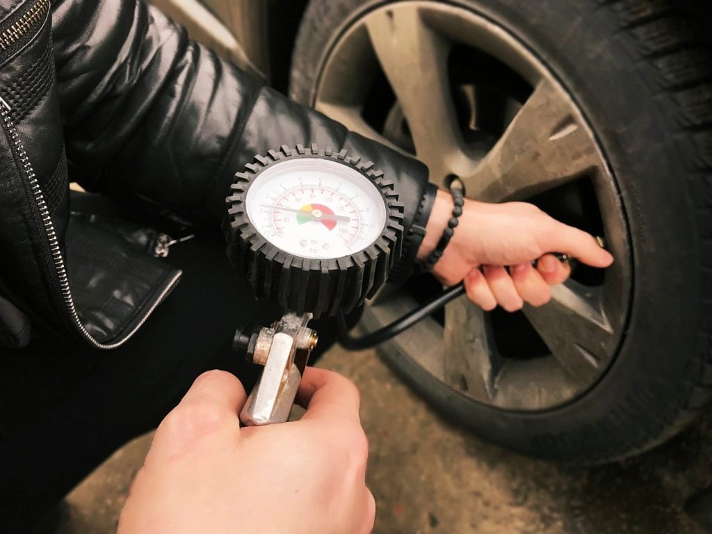 Person inflating their tires