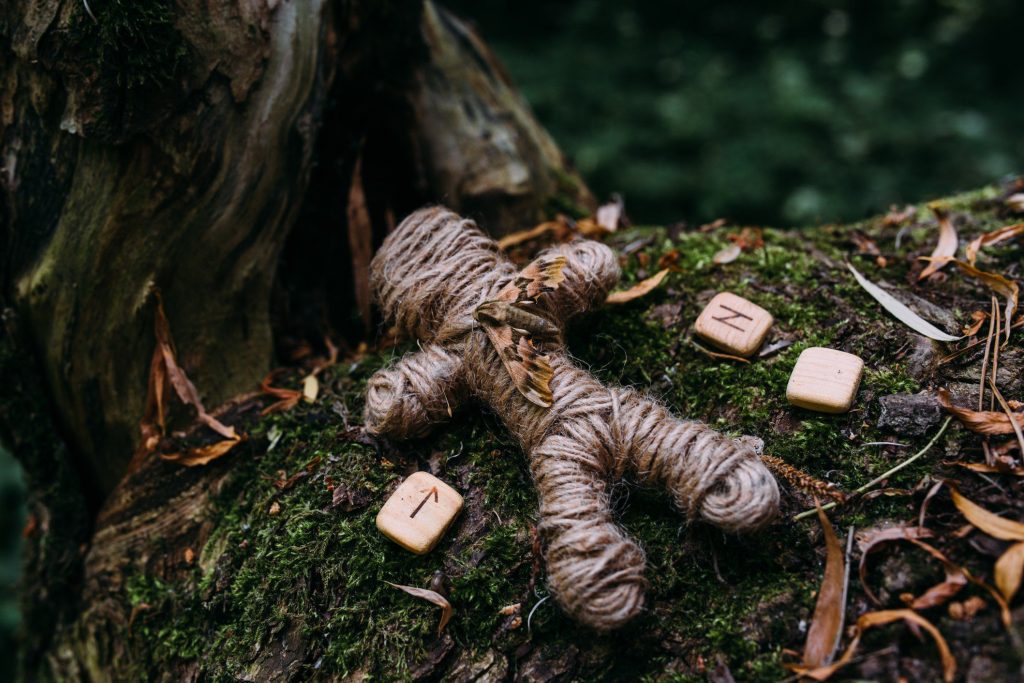 Voodoo doll in forest