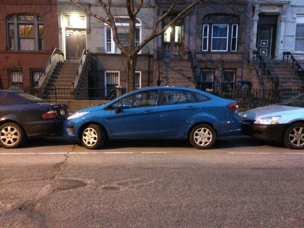 Cars parallel parked along road