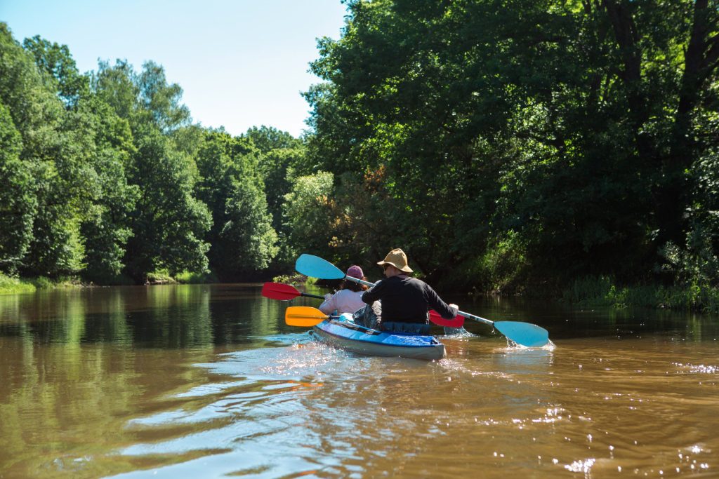 Two people kayaking down Missouri River