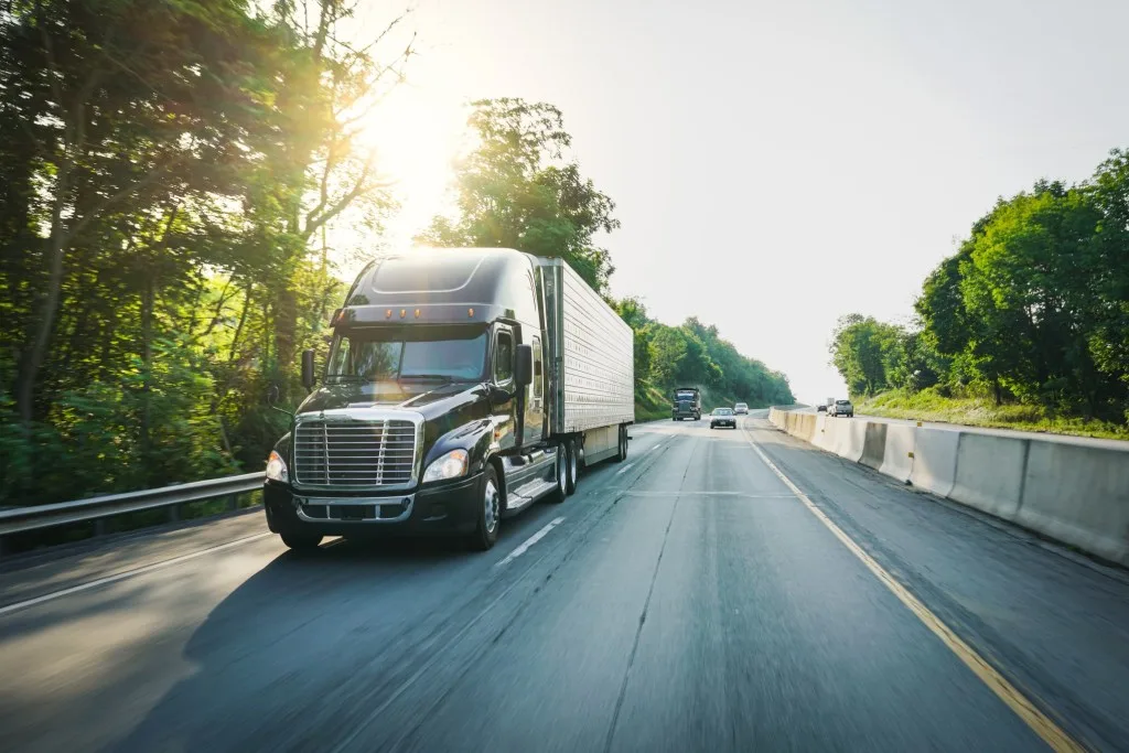 Front view of truck driving down highway