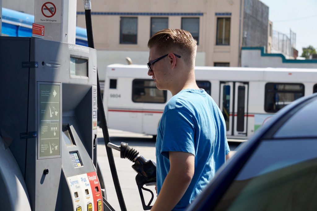 Man refueling car at gas station