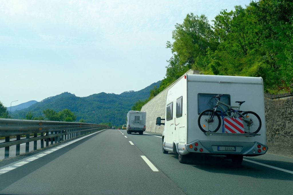 Two RVs driving down highway