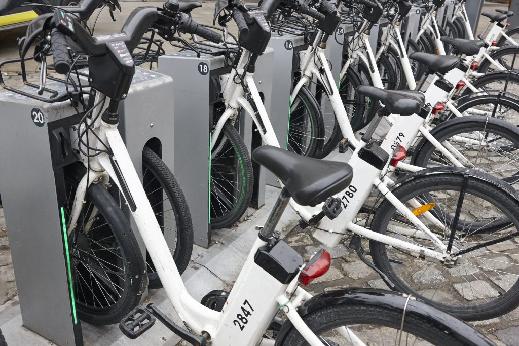 Charging electric bikes in the city. Urban green transportation