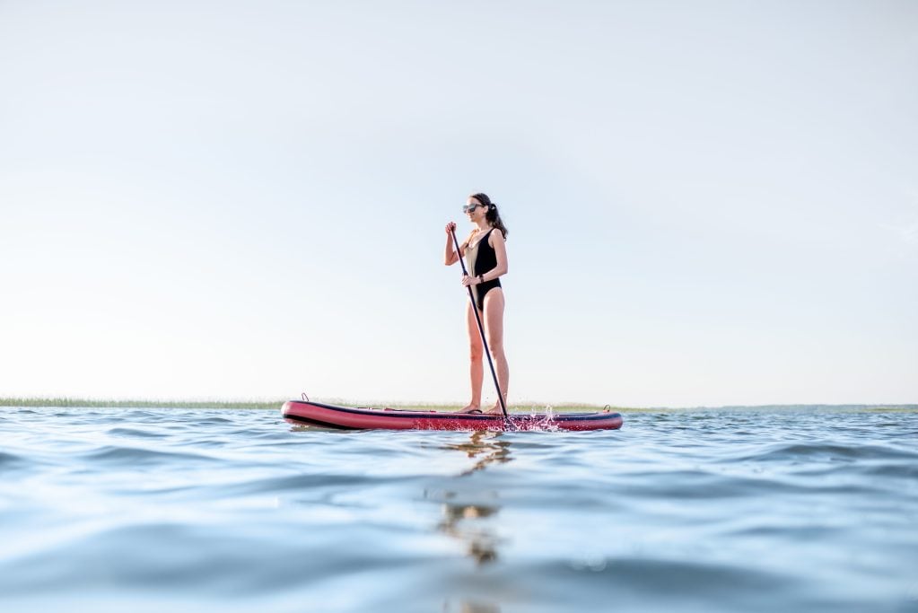 Woman paddling on a lake 