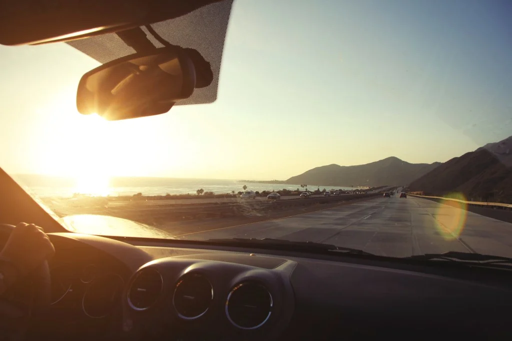 View out front car window while driving along Pacific Coast Highway