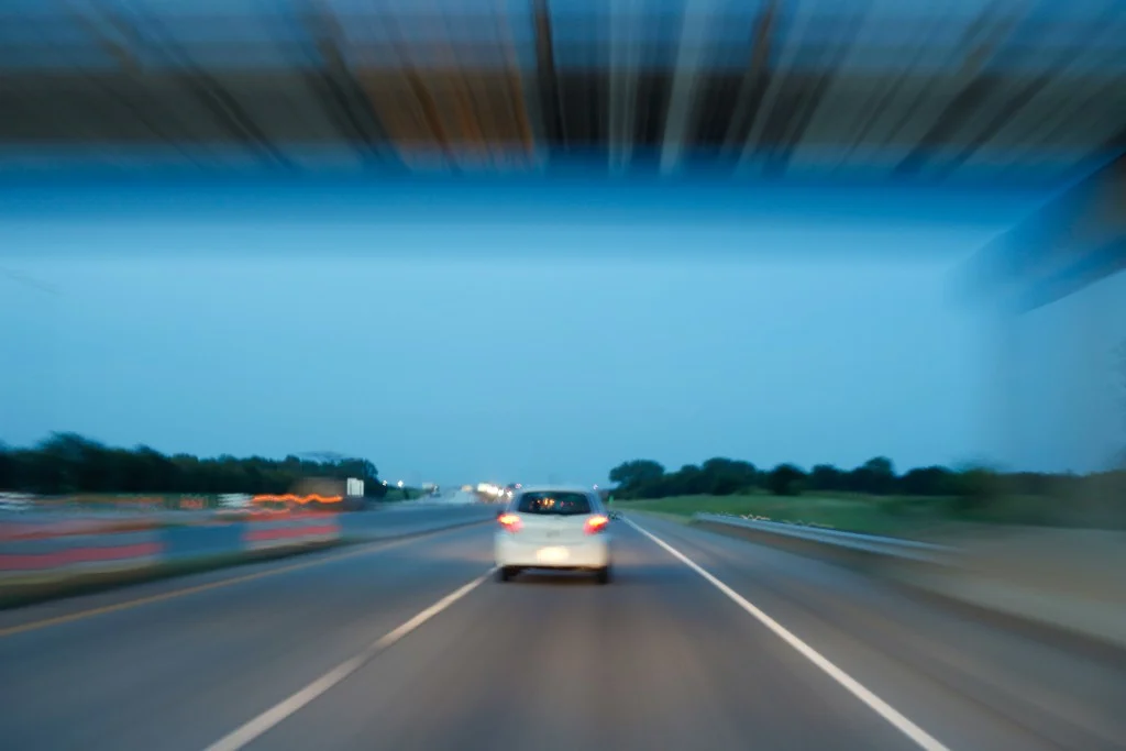 Cars speeding down the highway