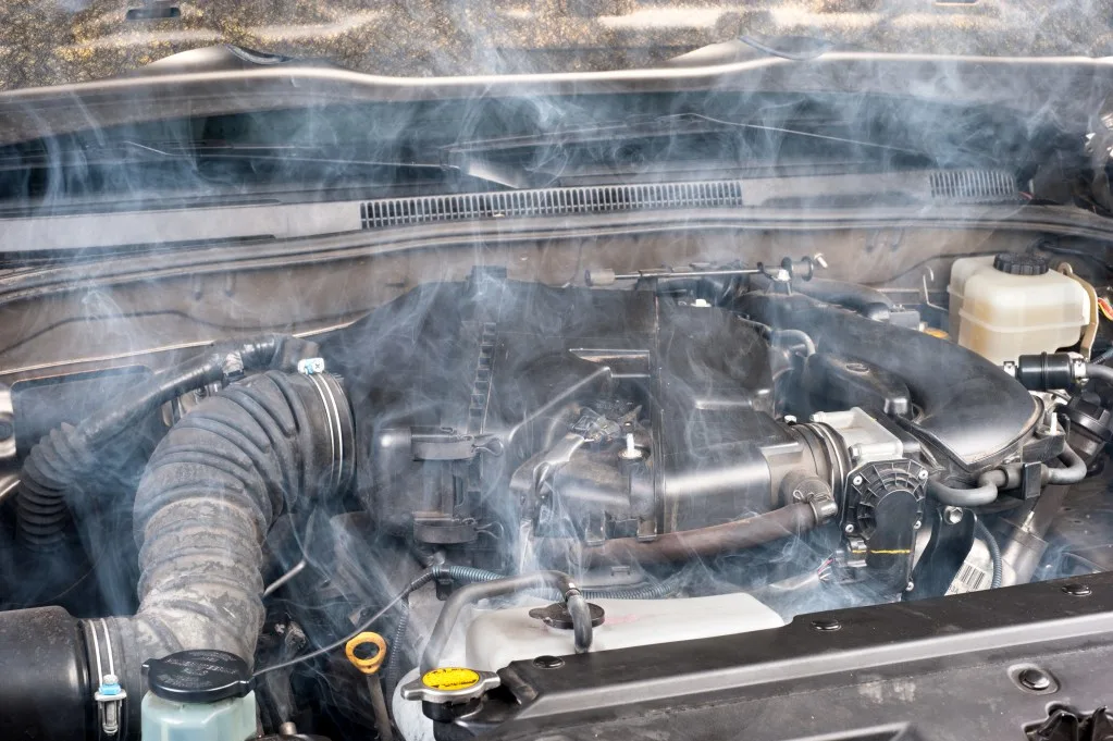 A smoky car engine overheating