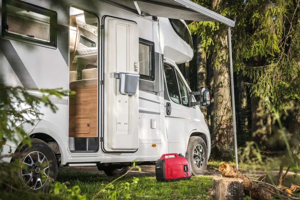 Red RV generator in front of RV