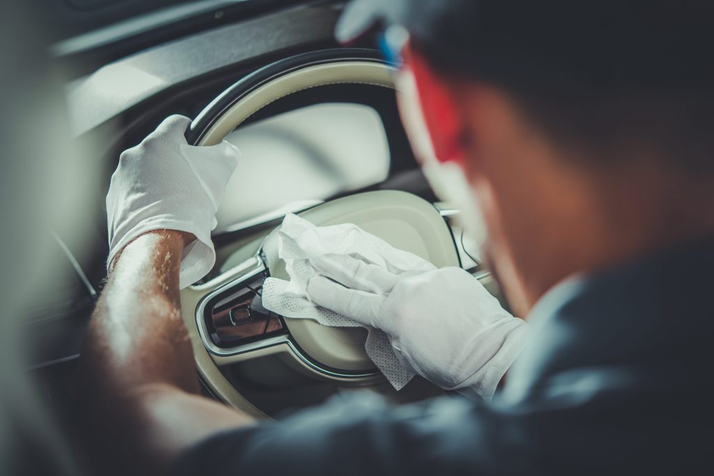 Man DIY auto detailing car steering wheel