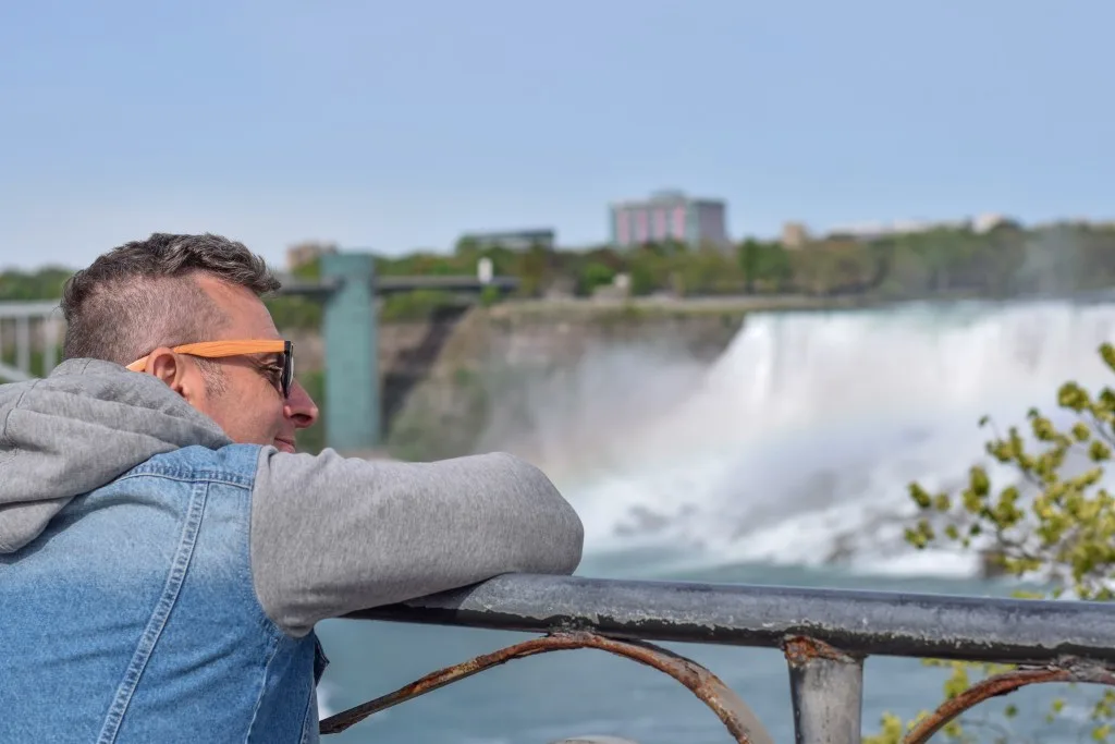 Man looking at view of Niagara Falls