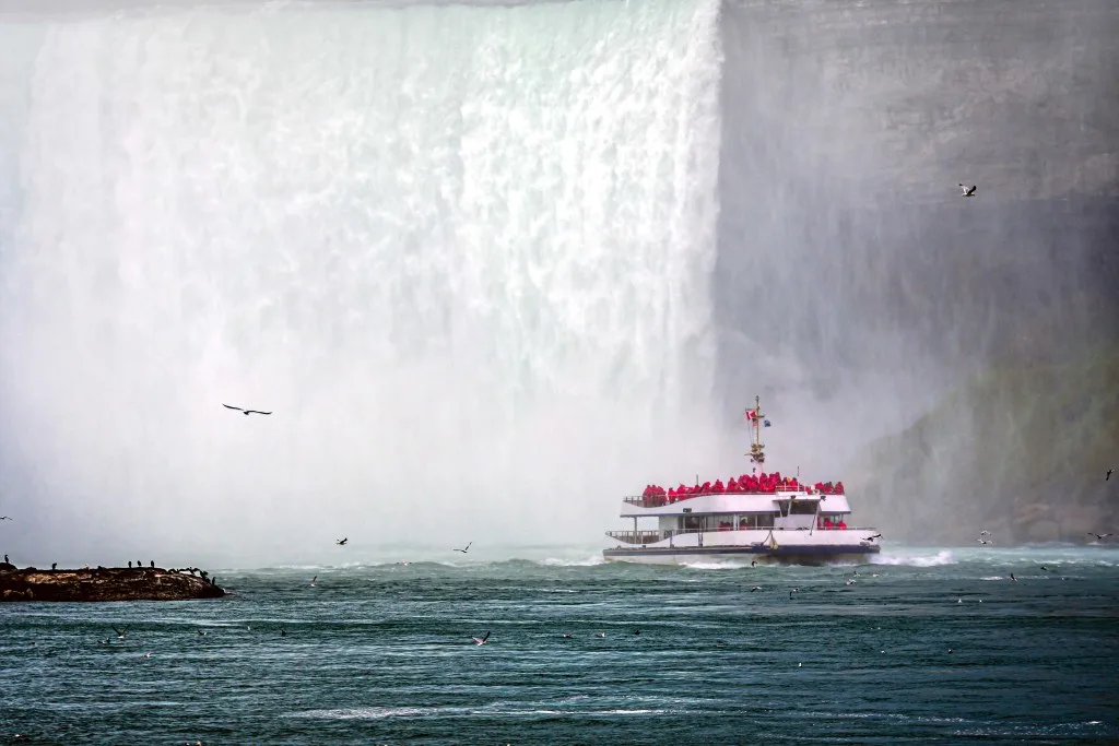 Tourist boat going under Niagara Falls