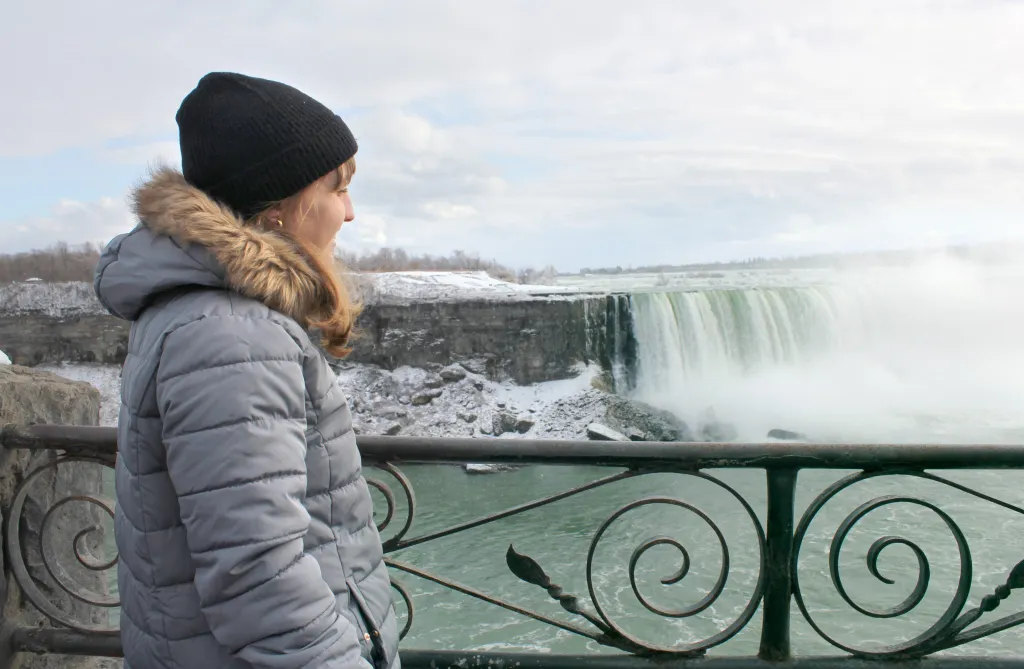 Woman looking at view of Niagara Falls