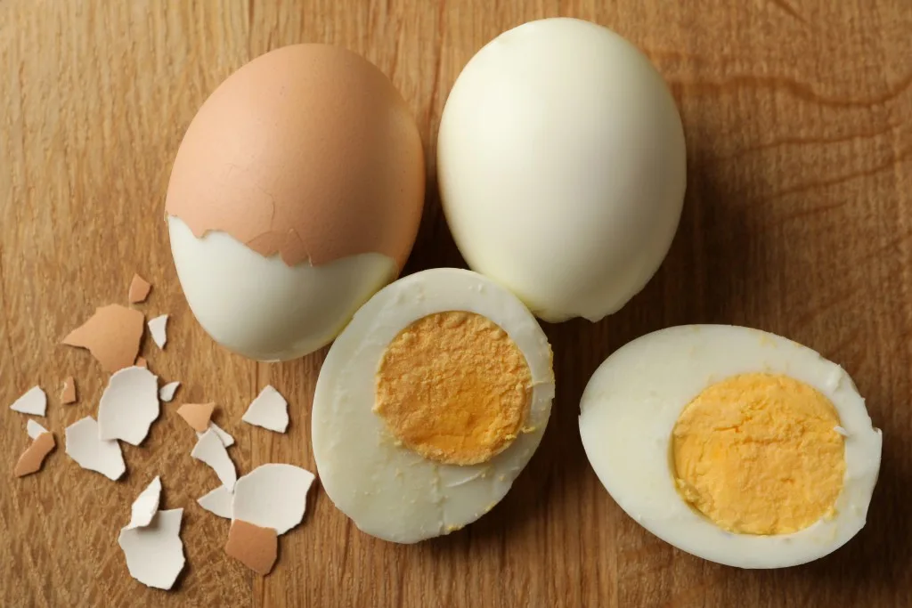 Hard boiled eggs being peeled