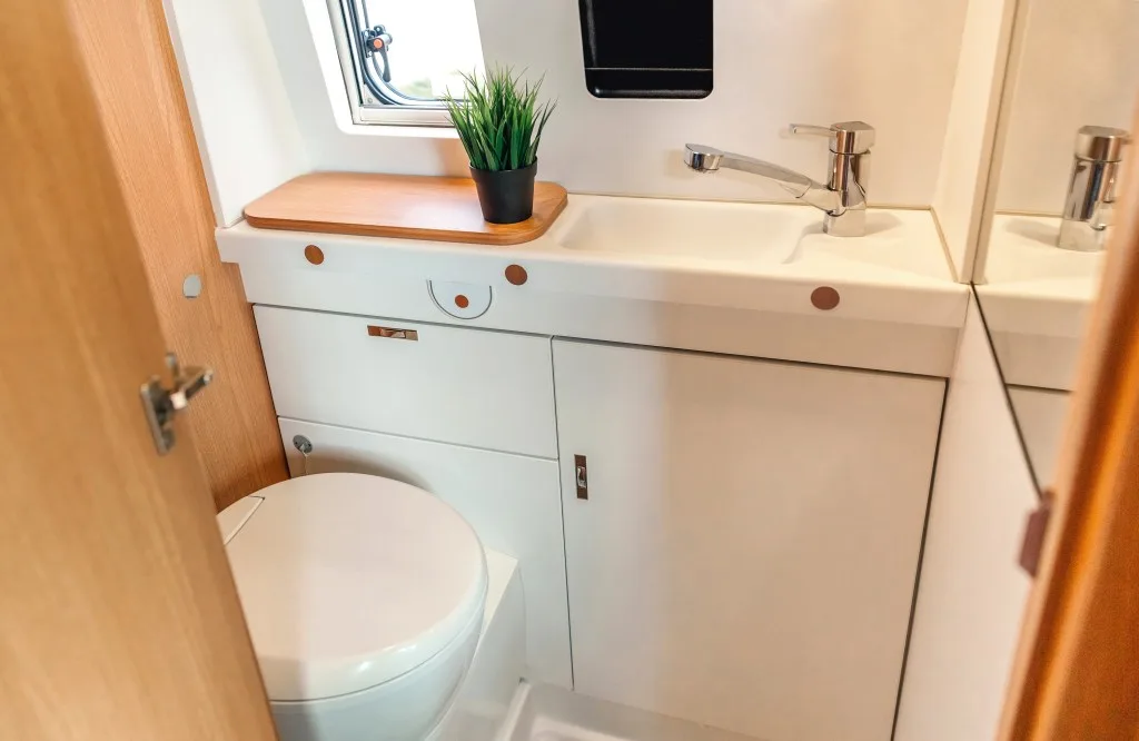 Interior of an RV bathroom with toilet and bidet