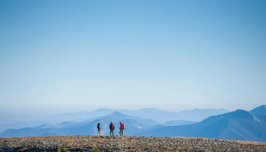 Three friends hiking in The Rockies