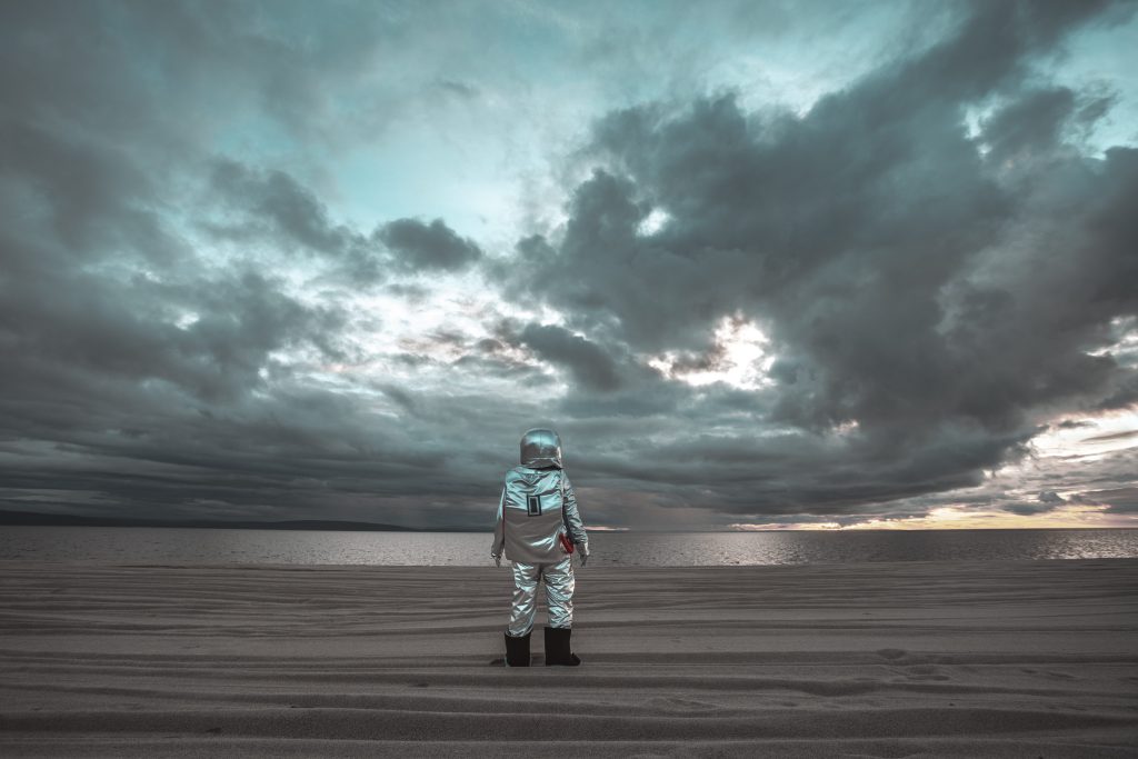 Man dressed as astronaut finding the Center of the Universe