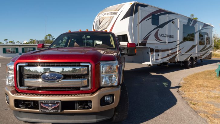 Florida, USA. 2022. A big red Ford towing a recreational vehicle.