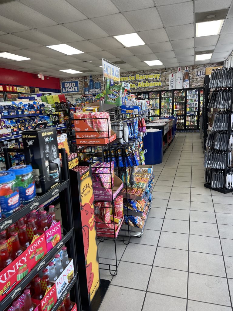A photo of several food and drink aisles in a Raceway gas station.