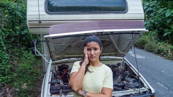 RV woman in front of broken rv