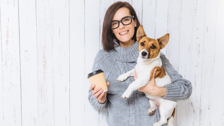 Woman with her dog and Starbucks pup cup