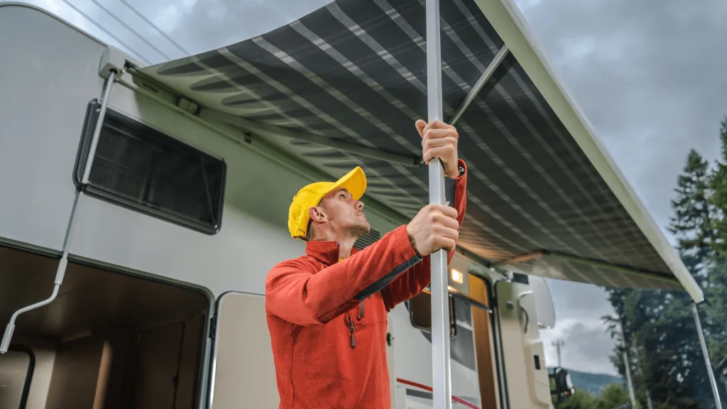 Man repairing RV awning