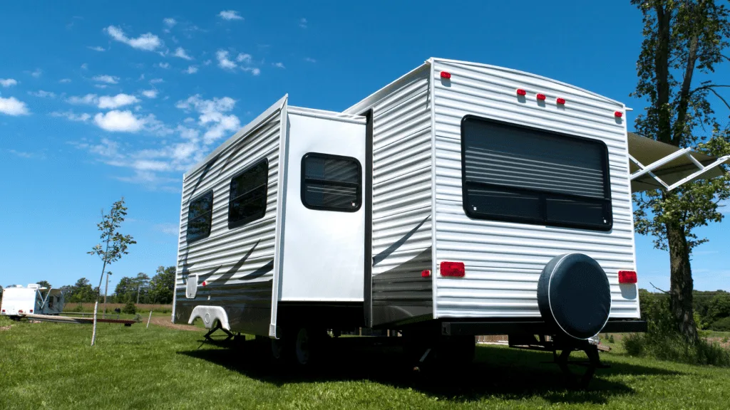 RV parked at campsite with slides out