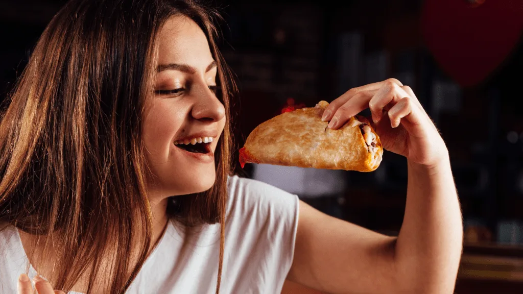 Woman eating Taco Bell