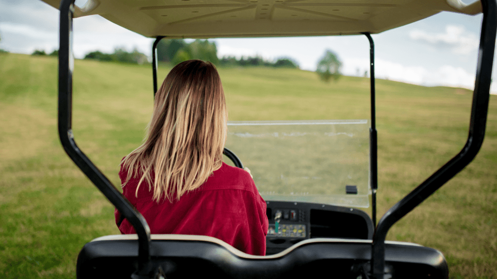 Woman driving golf course