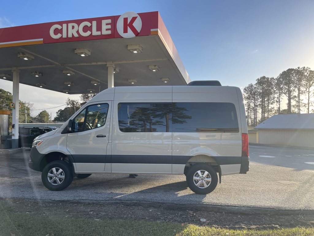 A photo of a white van under the Circle K sign.