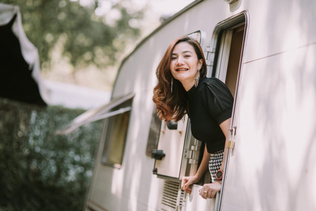 Woman leaning out window of RV