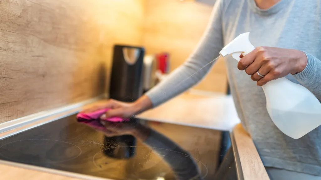 Woman cleaning oven