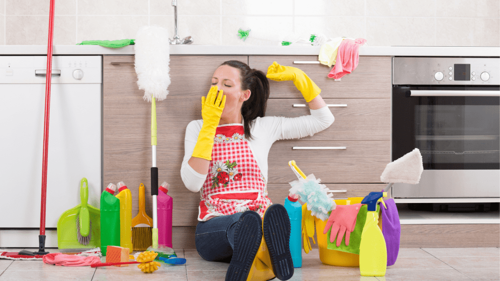 Woman tired from cleaning kitchen