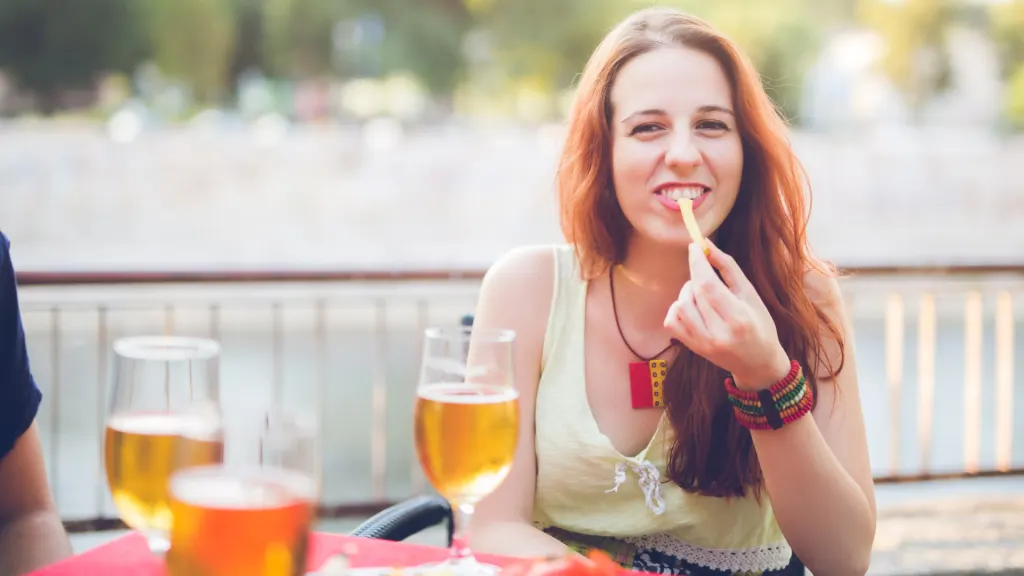 Woman eating french fries