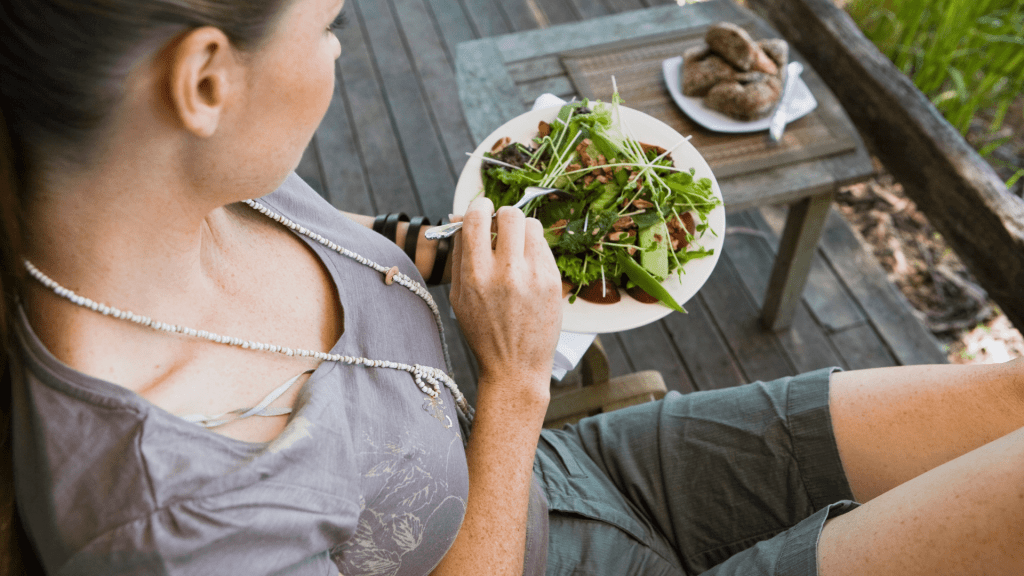 Woman eating fast food salad