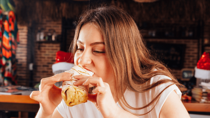 Woman eating Chimichanga