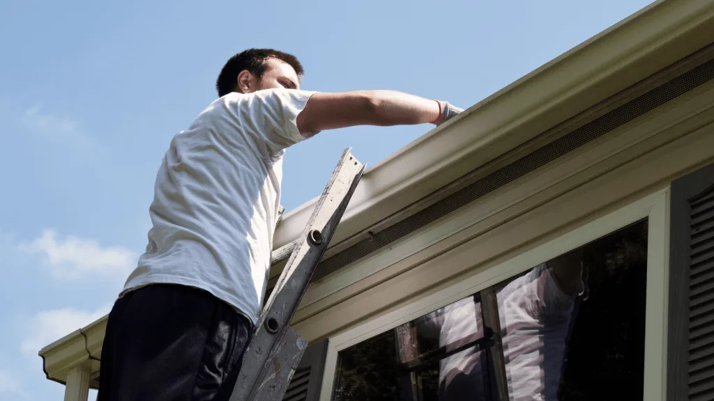 Man installing gutters