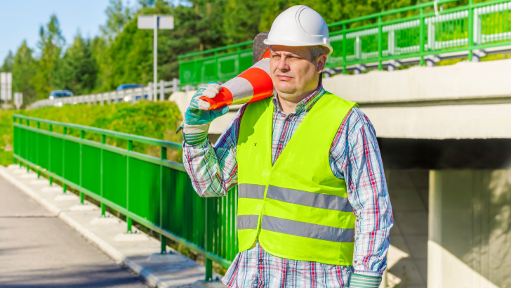 Man with construction cone