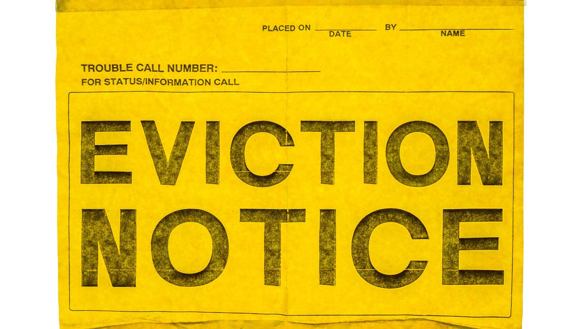 Isolated Eviction Notice On Yellow Paper With Sticky Tap On A White Background, potentially like the one RV parks use