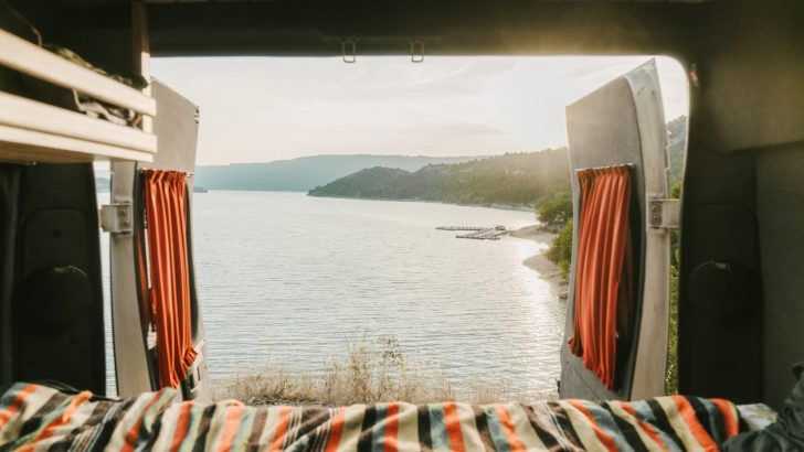 The view of a French lake in Europe from the inside of an RV