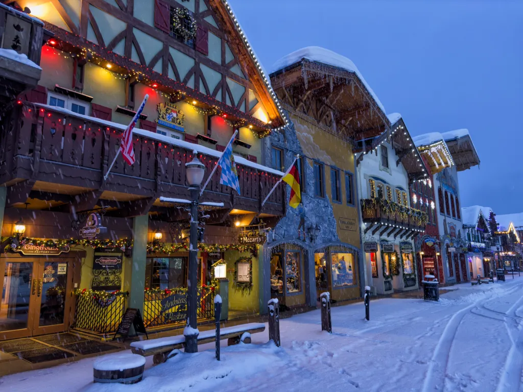 Street and buildings with Christmas lighting decoration in a snowy morning in Bavarian themed town of Leavenworth, Washington