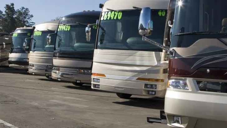 RVs parked and for sale at a dealership