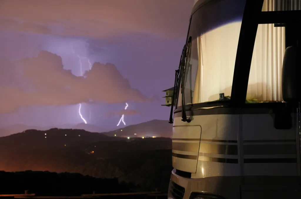 An rv with a storm in the distance. Should you protect your surge protector?
