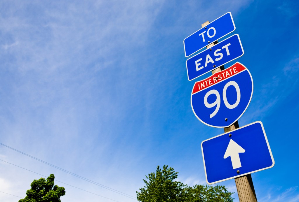 Photo of an freeway sign for eastbound on I-90. Interstate 90 is one of the best in the West.