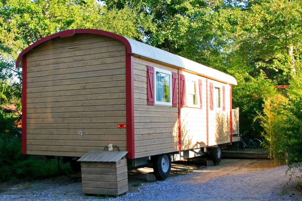 A photo of a tiny home built on a trailer for mobility like an RV