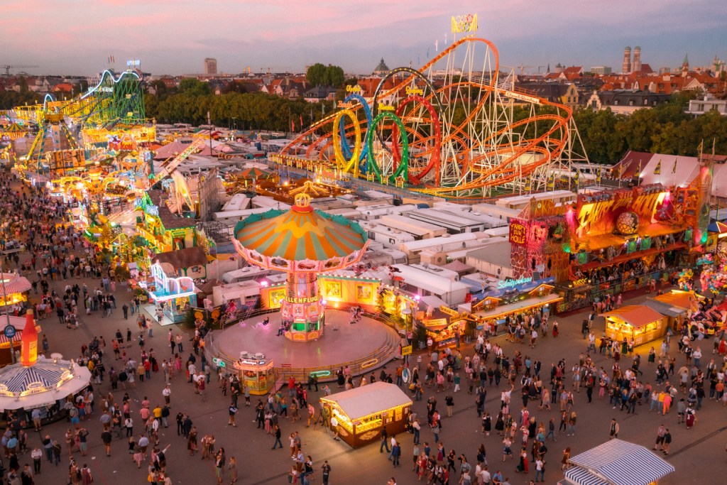 A photo of people and carnival rides at the Munich Oktoberfest
