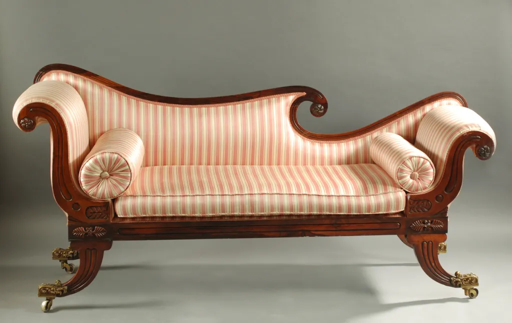 19th century Regency mahogany recamier/sofa, striped upholstery, English. King Galleries Auction House offers a variety of European antiques.
